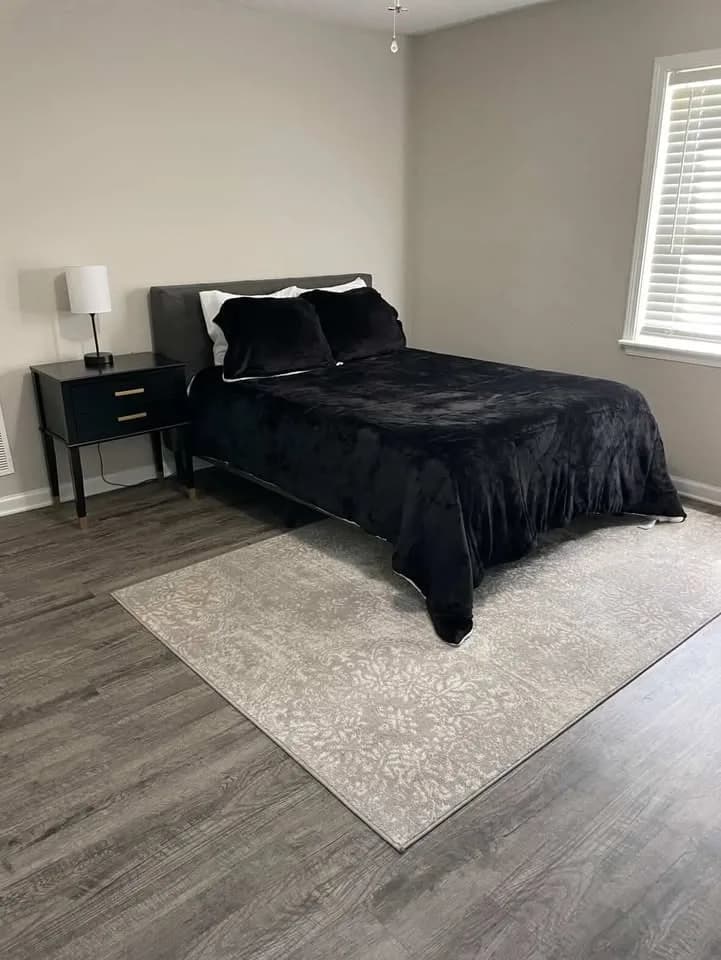 Beautifully cleaned bedroom in Jacksonville FL by Pristine Cleaning Gurus